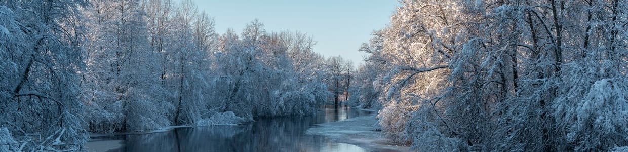 A winter river winding between snow-covered banks